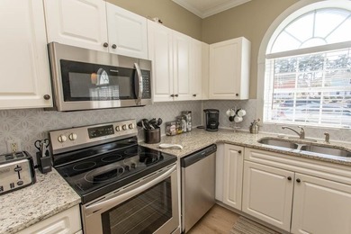 This rare ground floor, end unit has lots of natural light on  in South Carolina - for sale on GolfHomes.com, golf home, golf lot