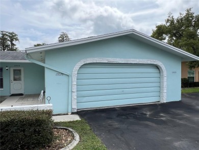 What a view! Come see this 1 bed, 1.5 bath home located on lake on Summertree Golf Course in Florida - for sale on GolfHomes.com, golf home, golf lot