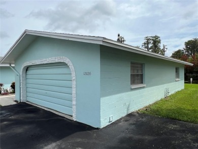 What a view! Come see this 1 bed, 1.5 bath home located on lake on Summertree Golf Course in Florida - for sale on GolfHomes.com, golf home, golf lot