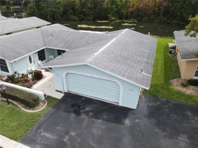 What a view! Come see this 1 bed, 1.5 bath home located on lake on Summertree Golf Course in Florida - for sale on GolfHomes.com, golf home, golf lot
