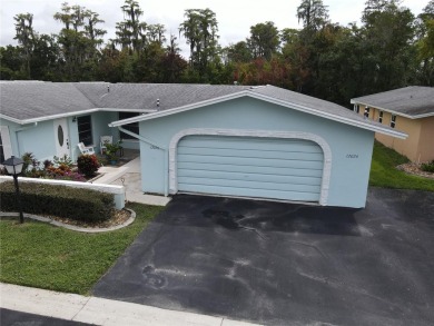What a view! Come see this 1 bed, 1.5 bath home located on lake on Summertree Golf Course in Florida - for sale on GolfHomes.com, golf home, golf lot
