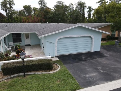 What a view! Come see this 1 bed, 1.5 bath home located on lake on Summertree Golf Course in Florida - for sale on GolfHomes.com, golf home, golf lot