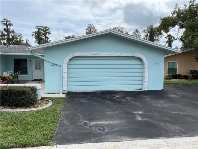 What a view! Come see this 1 bed, 1.5 bath home located on lake on Summertree Golf Course in Florida - for sale on GolfHomes.com, golf home, golf lot