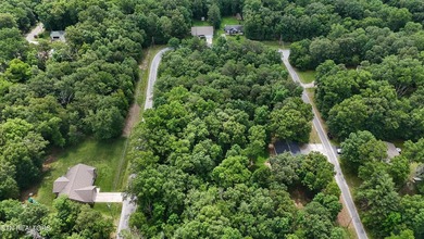 Settle into the serene side of Lake Tansi with this 0.26-acre on Lake Tansi Village Country Club in Tennessee - for sale on GolfHomes.com, golf home, golf lot