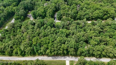 Settle into the serene side of Lake Tansi with this 0.26-acre on Lake Tansi Village Country Club in Tennessee - for sale on GolfHomes.com, golf home, golf lot