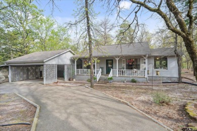 Beautifully maintained home in gated community. The cute covered on Holly Lake Ranch Golf Club in Texas - for sale on GolfHomes.com, golf home, golf lot