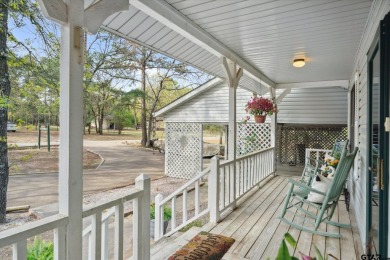 Beautifully maintained home in gated community. The cute covered on Holly Lake Ranch Golf Club in Texas - for sale on GolfHomes.com, golf home, golf lot