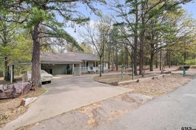 Beautifully maintained home in gated community. The cute covered on Holly Lake Ranch Golf Club in Texas - for sale on GolfHomes.com, golf home, golf lot