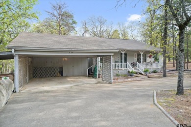 Beautifully maintained home in gated community. The cute covered on Holly Lake Ranch Golf Club in Texas - for sale on GolfHomes.com, golf home, golf lot