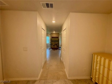 Charming Single-Family Home in Lehigh Acres - Spacious, Modern & on River Hall Country Club in Florida - for sale on GolfHomes.com, golf home, golf lot