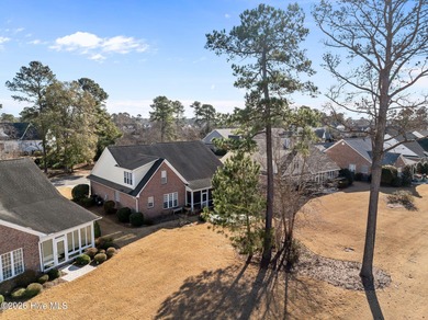Welcome home to this beautiful 5-bedroom, 3-bath brick residence on Magnolia Greens Golf Plantation in North Carolina - for sale on GolfHomes.com, golf home, golf lot
