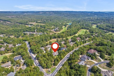 Nestled within the prestigious, gated, golf community of on Ledgestone Country Club and Golf Course in Missouri - for sale on GolfHomes.com, golf home, golf lot