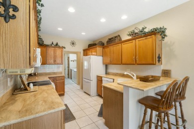 Nestled within the prestigious, gated, golf community of on Ledgestone Country Club and Golf Course in Missouri - for sale on GolfHomes.com, golf home, golf lot