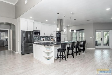 Beautifully remodeled lakefront home in The Estates at the SPI on South Padre Island Golf Club in Texas - for sale on GolfHomes.com, golf home, golf lot