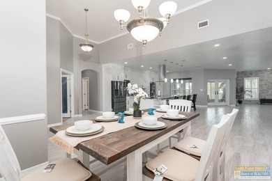 Beautifully remodeled lakefront home in The Estates at the SPI on South Padre Island Golf Club in Texas - for sale on GolfHomes.com, golf home, golf lot