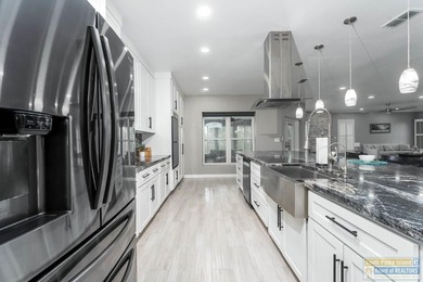 Beautifully remodeled lakefront home in The Estates at the SPI on South Padre Island Golf Club in Texas - for sale on GolfHomes.com, golf home, golf lot