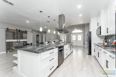 Beautifully remodeled lakefront home in The Estates at the SPI on South Padre Island Golf Club in Texas - for sale on GolfHomes.com, golf home, golf lot