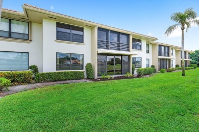 Spectacular lake and lush double fairway views from this 1st on Pine Tree Golf Club in Florida - for sale on GolfHomes.com, golf home, golf lot