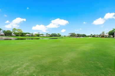 Spectacular lake and lush double fairway views from this 1st on Pine Tree Golf Club in Florida - for sale on GolfHomes.com, golf home, golf lot