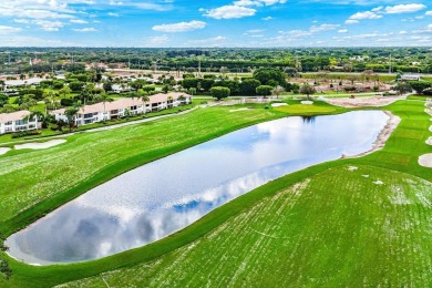 Spectacular lake and lush double fairway views from this 1st on Pine Tree Golf Club in Florida - for sale on GolfHomes.com, golf home, golf lot