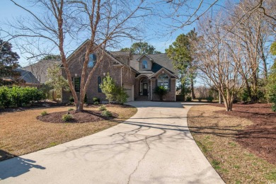 This lovely, traditional brick home located on the Waccamaw on Heritage Club in South Carolina - for sale on GolfHomes.com, golf home, golf lot