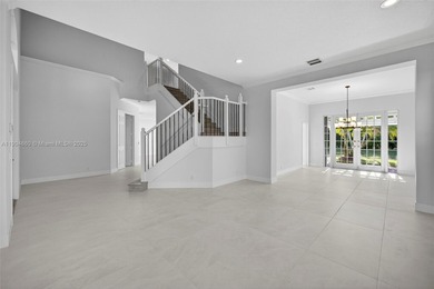 Fully renovated luxury home in the prestigious gated community on Weston Hills Country Club in Florida - for sale on GolfHomes.com, golf home, golf lot