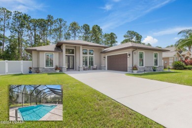 Welcome to 13 Elder Drive, Palm Coast - A Modern Masterpiece in on The Grand Club Cypress Course in Florida - for sale on GolfHomes.com, golf home, golf lot