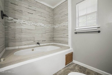 Welcome to your dream home! This beautifully renovated 5-bedroom on Mississippi National Golf Course in Mississippi - for sale on GolfHomes.com, golf home, golf lot