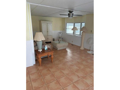Double wide manufactured home with separate shed. Financing on Spanish Lakes I in Florida - for sale on GolfHomes.com, golf home, golf lot
