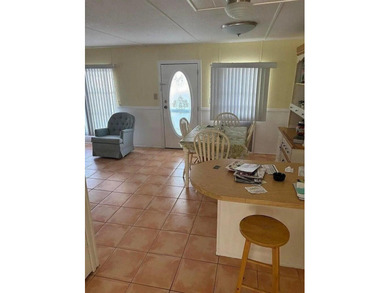 Double wide manufactured home with separate shed. Financing on Spanish Lakes I in Florida - for sale on GolfHomes.com, golf home, golf lot