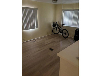 Double wide manufactured home with separate shed. Financing on Spanish Lakes I in Florida - for sale on GolfHomes.com, golf home, golf lot