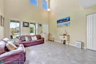 STUNNING 4-BEDROOM 3-BATHROOM POOL HOME IN THE HEART OF CORAL on Country Club of Coral Springs in Florida - for sale on GolfHomes.com, golf home, golf lot