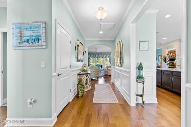 Experience refined coastal living in this beautifully appointed on Crow Creek Golf Club in North Carolina - for sale on GolfHomes.com, golf home, golf lot