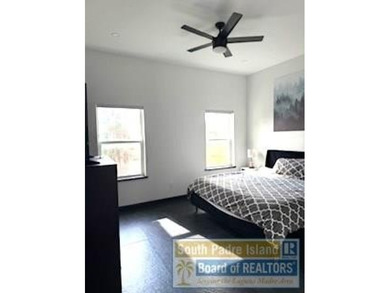 Luxury living in paradise! Located on prestigious Laguna Madre on South Padre Island Golf Club in Texas - for sale on GolfHomes.com, golf home, golf lot