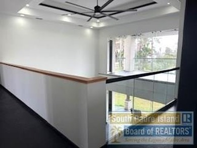 Luxury living in paradise! Located on prestigious Laguna Madre on South Padre Island Golf Club in Texas - for sale on GolfHomes.com, golf home, golf lot