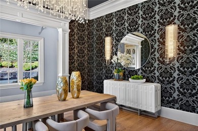 Perfectly positioned to capture sweeping views of the lake and on Manor Golf and Country Club in Georgia - for sale on GolfHomes.com, golf home, golf lot