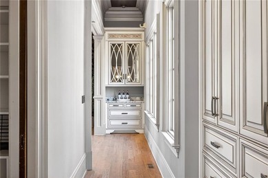 Perfectly positioned to capture sweeping views of the lake and on Manor Golf and Country Club in Georgia - for sale on GolfHomes.com, golf home, golf lot