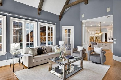 Perfectly positioned to capture sweeping views of the lake and on Manor Golf and Country Club in Georgia - for sale on GolfHomes.com, golf home, golf lot