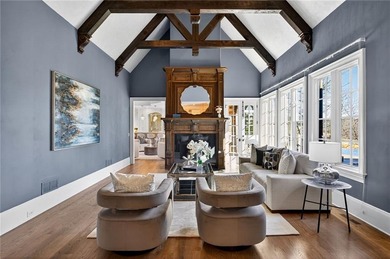 Perfectly positioned to capture sweeping views of the lake and on Manor Golf and Country Club in Georgia - for sale on GolfHomes.com, golf home, golf lot