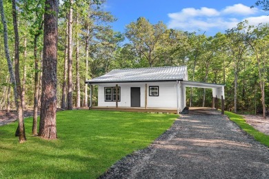 Nestled in the heart of Rayburn Country, this new construction on Rayburn Country Club in Texas - for sale on GolfHomes.com, golf home, golf lot