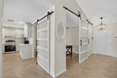 Open floor plan overlooking pool and golf course.  Besides the on Boca Greens Country Club in Florida - for sale on GolfHomes.com, golf home, golf lot