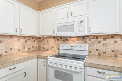 Well-maintained waterfront villa offering furnished, turn-key on South Padre Island Golf Club in Texas - for sale on GolfHomes.com, golf home, golf lot