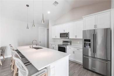 Nearly new construction, set directly on the Saltleaf Golf on Raptor Bay Golf Club in Florida - for sale on GolfHomes.com, golf home, golf lot