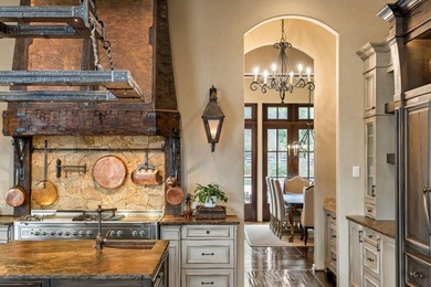 Now accepting Bitcoin. A triumph of architectural artistry on Alpharetta Athletic Club West in Georgia - for sale on GolfHomes.com, golf home, golf lot