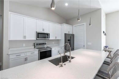 Nearly new construction, set directly on the Saltleaf Golf on Raptor Bay Golf Club in Florida - for sale on GolfHomes.com, golf home, golf lot