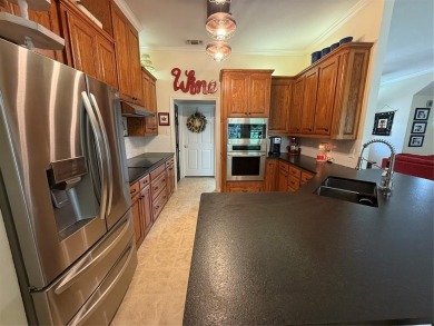 Located in the highly sought-after gated community of Pecan on Pecan Plantation Country Club in Texas - for sale on GolfHomes.com, golf home, golf lot