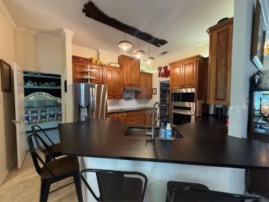 Located in the highly sought-after gated community of Pecan on Pecan Plantation Country Club in Texas - for sale on GolfHomes.com, golf home, golf lot