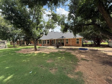 Located in the highly sought-after gated community of Pecan on Pecan Plantation Country Club in Texas - for sale on GolfHomes.com, golf home, golf lot