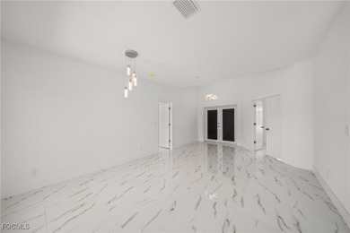 Stunning brand new modern home offering 3 bedrooms plus a on Del Tura Golf and Country Club in Florida - for sale on GolfHomes.com, golf home, golf lot