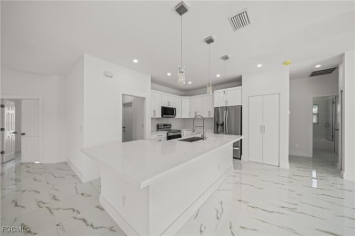 Stunning brand new modern home offering 3 bedrooms plus a on Del Tura Golf and Country Club in Florida - for sale on GolfHomes.com, golf home, golf lot